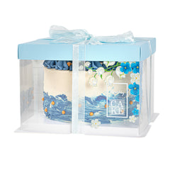 Sweet Vision Square Clear Plastic Cake Box - Blue Lid and White Base, Blue Ribbon, Flower Accent - 8 1/2